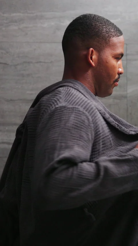 Bathrobe, mirror and undressing with black man in bathroom for morning routine Stock Footage 341423811