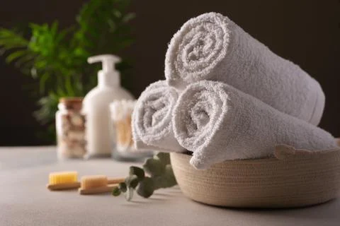 Bathroom and spa concept. White towels, bamboo toothbrushes and other bath ac Stock Photos