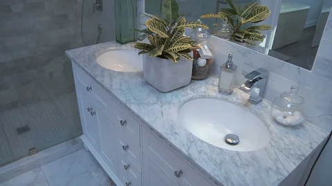 Bathroom with chest of drawers and two sinks Stock Footage 111495050
