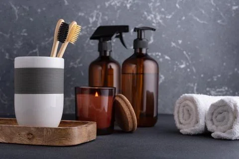 Bathroom composition with bamboo toothbrushes and recycled cosmetic bootles.  Stock Photos