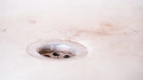 Bathroom with dirty drain hole, close up Stock Footage 239997996