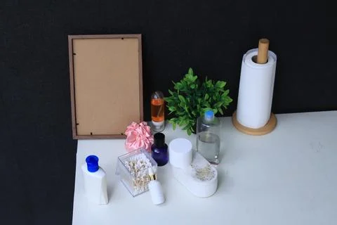 Bathroom essentials and decorative items arranged on a white surface Stock Photos