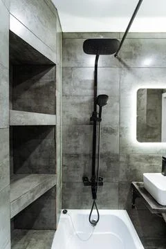 The bathroom features a spacious layout that includes essential elements li.. Stock Photos