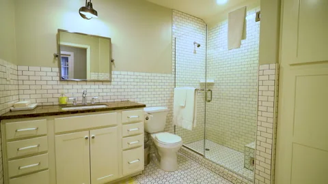 Bathroom with glass shower subway tile and white vanity Stock Footage 345693633