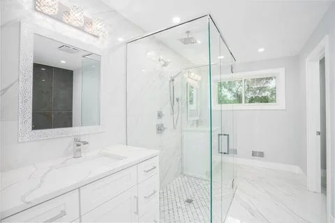 Bathroom has been udated with new tiles and fixtures Stock Photos