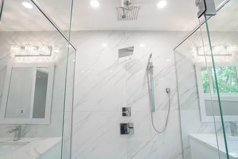 Bathroom has been udated with new tiles and fixtures Stock Photos