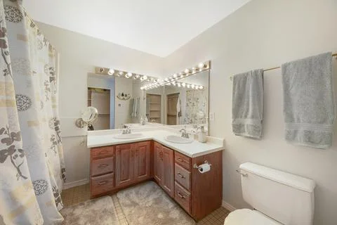 Bathroom interior with L-shaped double vanity sink Stock Photos