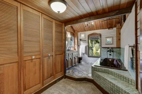 Bathroom interior in a luxurious log cabin. Northwest, USA Stock Photos