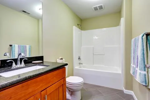 Bathroom interior with  tile floor and mint walls. Stock Photos