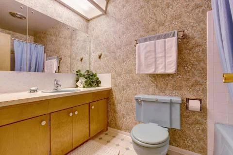 Bathroom with light brown wallpaper Stock Photos