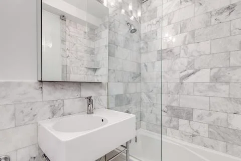 Bathroom with marble shower. Stock Photos