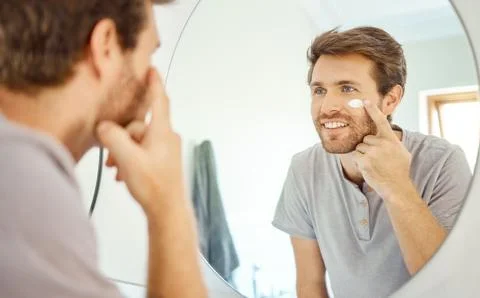 Bathroom, mirror reflection or man with cream, lotion or moisturizer for acne Stock Photos