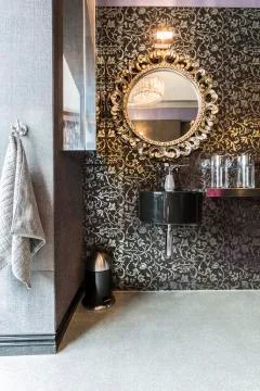 Bathroom with pattern wallpaper, sparkle floor Stock Photos