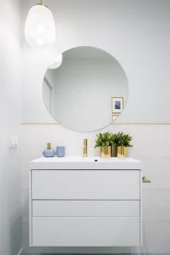Bathroom with round mirror Stock Photos