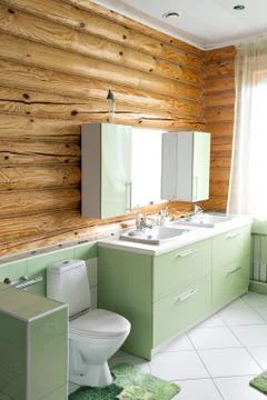 The bathroom in a rustic log cabin, in the mountains. with a beautiful interior Stock Photos