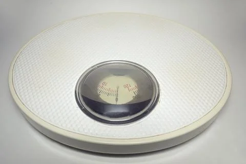 Bathroom scales. Solid steel with white ribbed surface. rotating red and bl.. Stock Photos