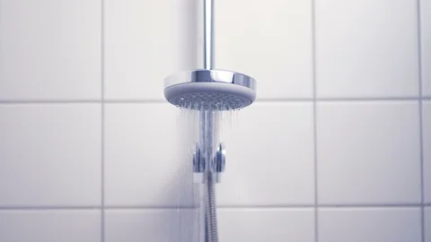 Bathroom - shower head turning on Stock Footage 91775076
