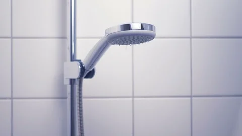 Bathroom - shower head turning on Stock Footage 91818486