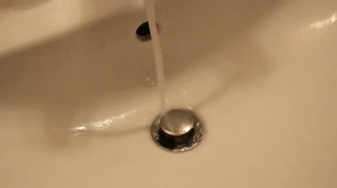 Bathroom Sink Drain with Water Running (58) Stock Footage 24789530