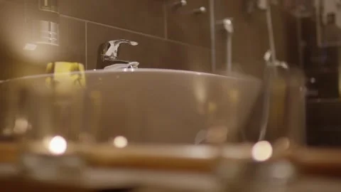 Bathroom Sink in Warm Candlelight, Cozy Spa Wellness Bathroom, Close Up Shot Vídeo Stock 341990070