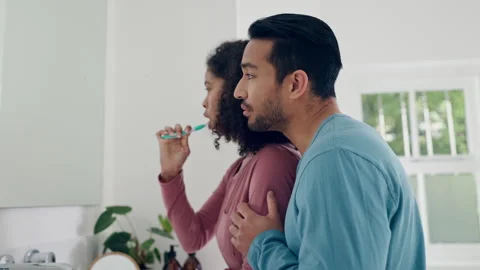 Bathroom, talking and couple hug, brushing teeth and speaking about toothbrush Stock Footage 250068624