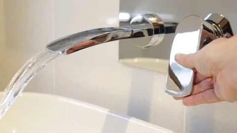 Bathroom tap being turned on Stock Footage 73271875