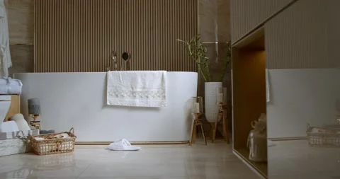 Bathroom tiled with marble tiles in different shades of brown Stock Footage 153104651