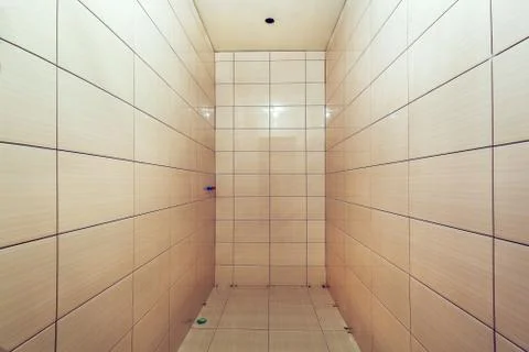 Bathroom with tiled walls before installing shower and sink, is in the apartment Stock Photos