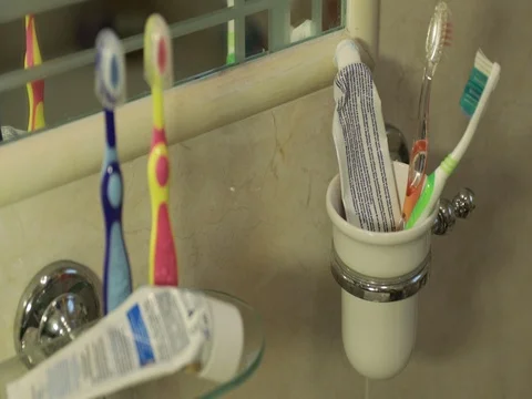 Bathroom with toothbrushes and toothpaste Stock Footage 74239292