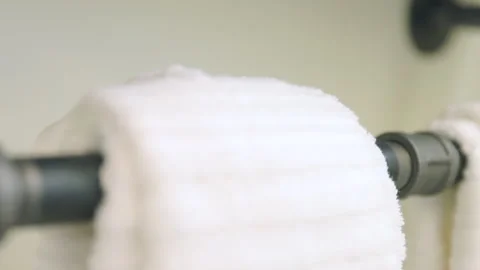 Bathroom Towels Hanging on Rustic Pipe Rack Décor Move Left Stock Footage 244174352