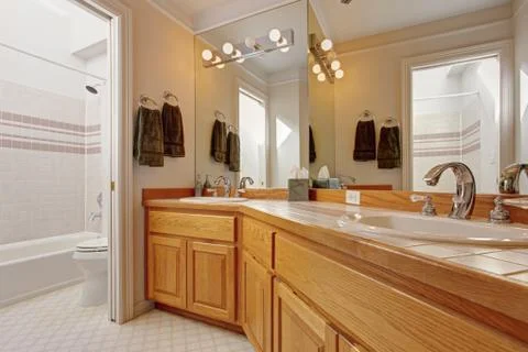 Bathroom vanity cabinet with two sinks and mirror Stock Photos