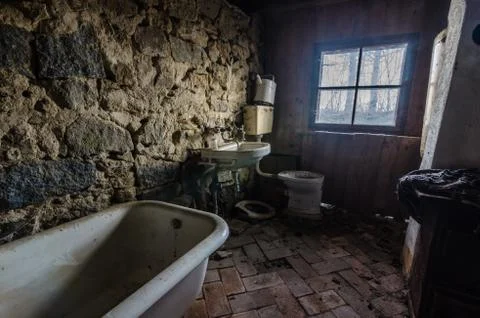 Bathroom with wall of stone Stock Photos