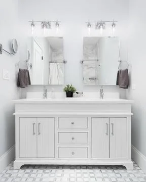 A bathroom with a white cabinet and pattern tile floor. Stock-Fotos