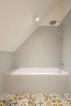 Bathtub in the bathroom interior Stock Photos