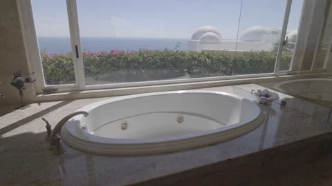 Bathtub in bathroom with ocean backround Vídeos de archivo 247200449