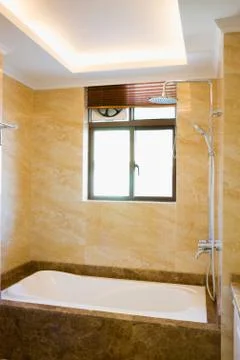 Bathtub in bathroom Stock Photos
