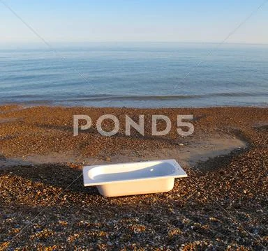 Bathtub on beach Stock Photos