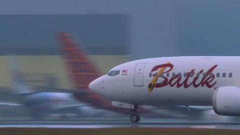 Batik Air Malaysia take off during downpour Stock Footage 313833683