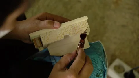 Batik application on accessories box decoration with wooden material Stock Footage 245881097