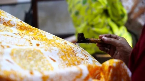 Batik, Close Up hand and canting Stock Footage 143976141