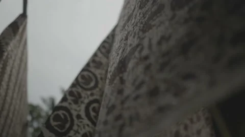 Batik in Java Traditional Fabric of Indonesia - Hanged Cloths Blown by The Wind Video stock 178493740