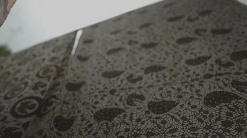 Batik in Java Traditional Fabric of Indonesia - Hanged Cloths Blown by The Wind Video stock 178498667