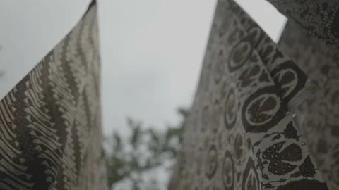 Batik in Java Traditional Fabric of Indonesia - Hanged Cloths Blown by The Wind Video stock 178507317