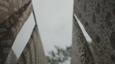 Batik in Java Traditional Fabric of Indonesia - Hanged Cloths Blown by The Wind Video stock 178510511