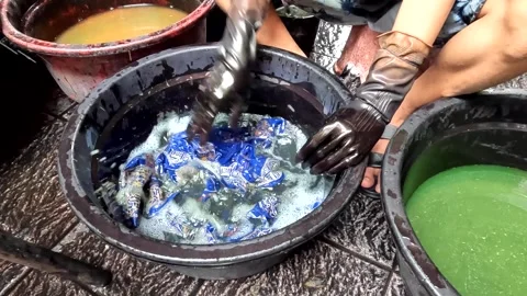 Batik Making process in a factory in Indonesia Stock Footage 319625360