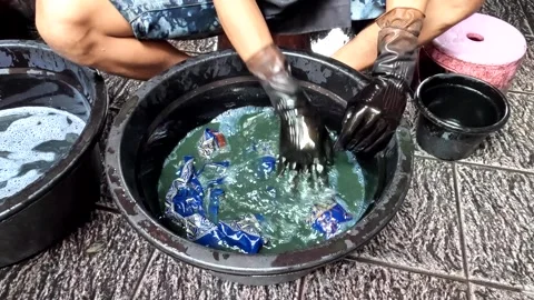 Batik Making process in a factory in Indonesia Stock Footage 319625500