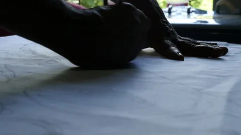 Batik manufacture - Pattern being drawn Stock Footage 105498947