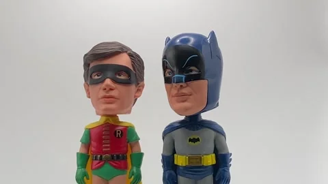 Batman and Robin bobblehead figures from the original 1960s tv series rotating Stock Footage 343366490