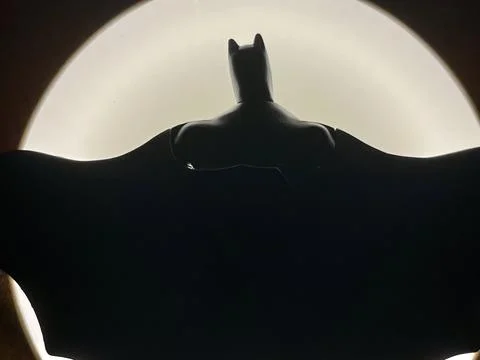 Batman DC Comics toy action figure batsignal silhouette Stock Photos