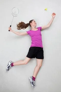 Batminton player serving shuttlecock Stock Photos